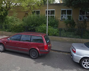 car parked outside a school