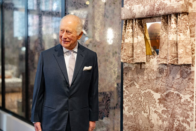 The King unveiled a commemorative plaque — revealed from behind a curtain made from the collection's own 'Highgrove Toile' fabric