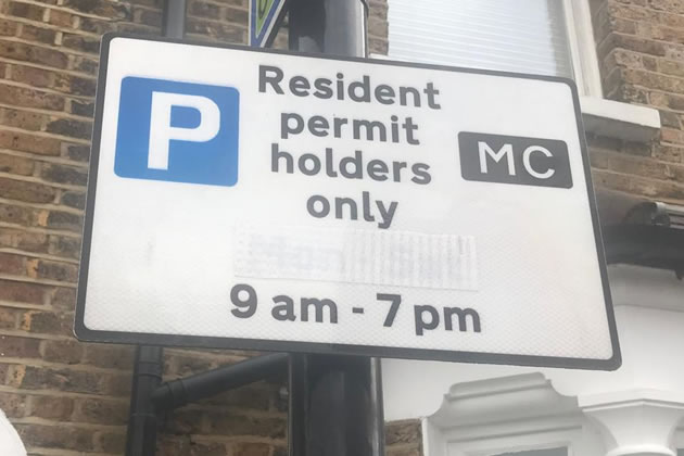 The original wording of the signs can still be made out despite attempts to obscure them