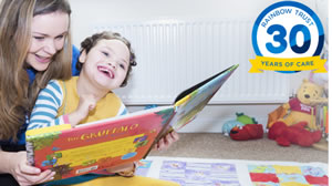 Image of a woman reading to a child for Rainbow Trust charity for disadvantaged children 