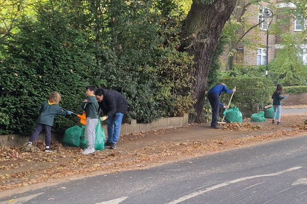 Cub scouts collecting leaves in Ealing