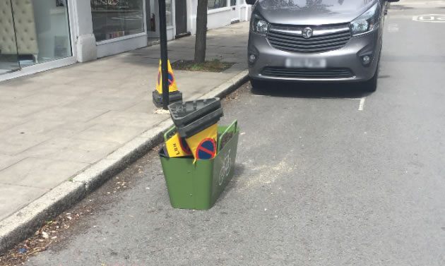 Parking cones deposited in planter on Devonshire Road