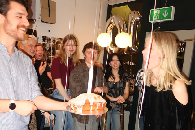 Blowing out the candles at the tenth birthday party 