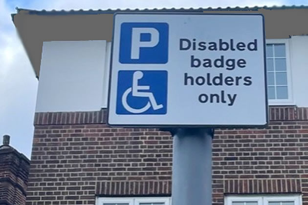A disabled bay parking sign
